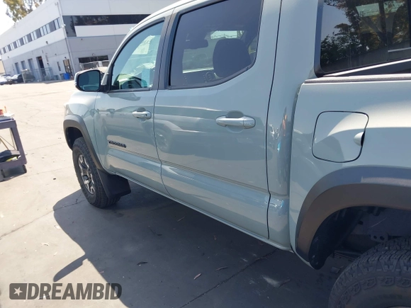 2023 Toyota Tacoma SR with VIN 3TMCZ5AN3PM590101, listed as a IAAI auction lot 42338670 with 12,970 mi miles and . Bid and sale history available at DreamBid. Image 14.
