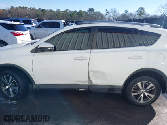 2018 Toyota RAV4 XLE with VIN JTMWFREV7JJ743297, listed as a IAAI auction lot 41579019 with 102,442 mi miles. Bid and sale history available at carsss.com. Image 14.