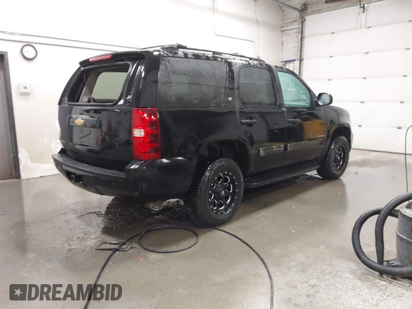 2013 Chevrolet Tahoe LT with VIN 1GNSKBE07DR305706, listed as a IAAI auction lot 42004594 with 166,020 mi miles and . Bid and sale history available at DreamBid. Image 4.