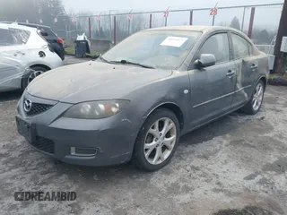 2009 Mazda Mazda3 i Touring Value with VIN JM1BK32G291214834, listed as a IAAI auction lot 40894075 with 128,040 mi miles. Bid and sale history available at carsss.com. Image 2.