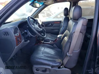 2004 GMC Envoy SLT with VIN 1GKET16S446131726, listed as a Copart auction lot 76033954 with Not Provided miles and Salvage Title. Bid and sale history available at DreamBid. Image 7.