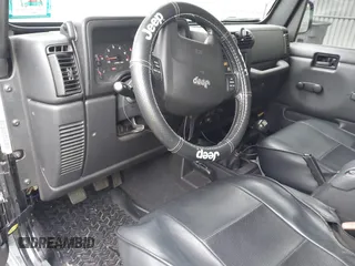 2006 Jeep Wrangler Rubicon z VIN 1J4FA69S76P749712, wystawiony jako IAAI lot #42240375 z przebiegiem 75 405 mil mil oraz . Historia ofert i sprzedaży dostępna na DreamBid. Obrazek 5.