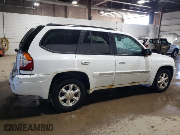 2005 GMC Envoy SLE z VIN 1GKDT13S452360609, wystawiony jako Copart lot #56188495 z przebiegiem 180 046 mil mil oraz Szkoda całkowita • Salvage title. Historia ofert i sprzedaży dostępna na DreamBid. Obrazek 3.