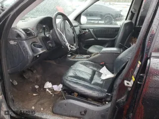 2001 Mercedes-Benz M-Class with VIN 4JGAB54E51A273024, listed as a Copart auction lot 80327264 with 211,120 mi miles and Salvage Title. Bid and sale history available at carsss.com. Image 7.