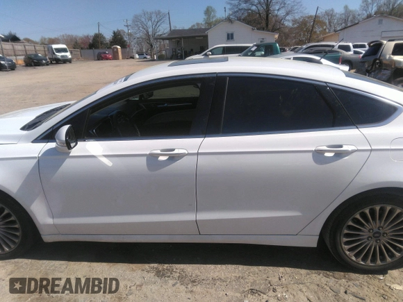 2016 Ford Fusion Titanium with VIN 3FA6P0K93GR331947, listed as a IAAI auction lot 41828409 with 181,555 mi miles and . Bid and sale history available at DreamBid. Image 14.