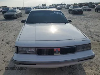1995 Oldsmobile Cutlass Ciera SL z VIN 1G3AJ55M4S6330007, wystawiony jako Copart lot #72716844 z przebiegiem 155 400 mil mil oraz Szkody całkowita. Historia ofert i sprzedaży dostępna na DreamBid. Obrazek 5.