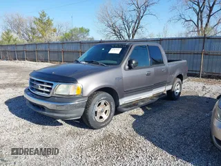 2003 Ford F-150 XLT with VIN 1FTRW07L13KB66977, listed as a IAAI auction lot 41967541 with 124,714 mi miles. Bid and sale history available at carsss.com. Image 2.