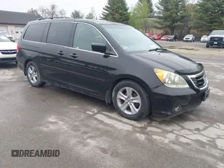 2010 Honda Odyssey Touring with VIN 5FNRL3H97AB056975, listed as a IAAI auction lot 42169269 with 183,483 mi miles. Bid and sale history available at carsss.com. Image 1.