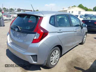 2017 Honda Fit LX with VIN JHMGK5H51HS023212, listed as a IAAI auction lot 42153107 with 106,778 mi miles. Bid and sale history available at carsss.com. Image 4.