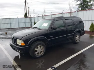 1999 Oldsmobile Bravada with VIN 1GHDT13W0X2712225, listed as a IAAI auction lot 41550117 with 170,706 mi miles. Bid and sale history available at carsss.com. Image 2.