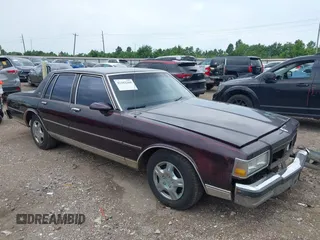 1990 Chevrolet Caprice z VIN 1G1BN54E9LR104492, wystawiony jako IAAI lot #42442260 z przebiegiem 39 468 mil mil oraz . Historia ofert i sprzedaży dostępna na DreamBid. Obrazek 1.