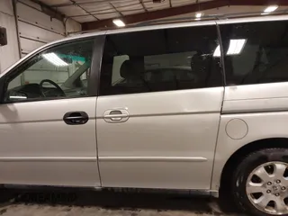 2004 Honda Odyssey EX-L with VIN 5FNRL18974B127696, listed as a IAAI auction lot 41643243 with 200,286 mi miles and . Bid and sale history available at DreamBid. Image 15.
