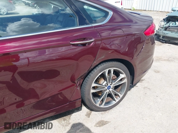 2017 Ford Fusion Titanium with VIN 3FA6P0K97HR214485, listed as a IAAI auction lot 40208619 with 39,265 mi miles and . Bid and sale history available at DreamBid. Image 6.