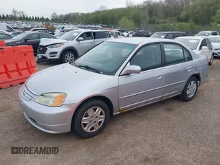 2003 Honda Civic LX with VIN 2HGES16533H571332, listed as a IAAI auction lot 42153221 with 202,926 mi miles. Bid and sale history available at carsss.com. Image 2.