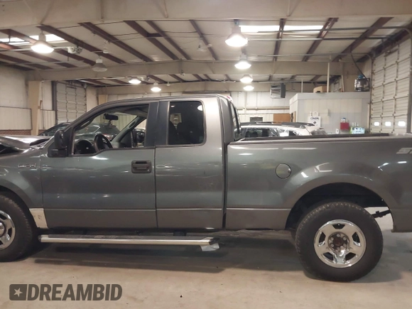 2005 Ford F-150 STX with VIN 1FTRX12W95NB38107, listed as a IAAI auction lot 41185100 with 201,171 mi miles. Bid and sale history available at carsss.com. Image 14.