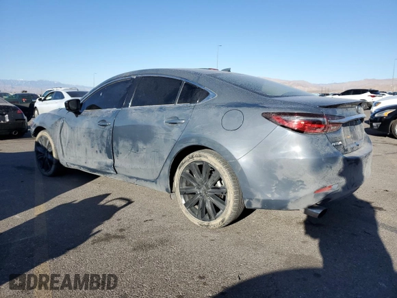 2021 Mazda 6 Carbon Edition with VIN JM1GL1WY0M1610974, listed as a Copart auction lot 84961604 with 55,107 mi miles and Salvage Title. Bid and sale history available at DreamBid. Image 2.