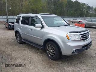 2014 Honda Pilot Touring with VIN 5FNYF4H91EB011934, listed as a IAAI auction lot 41929415 with 227,343 mi miles and . Bid and sale history available at carsss.com. Image 1.