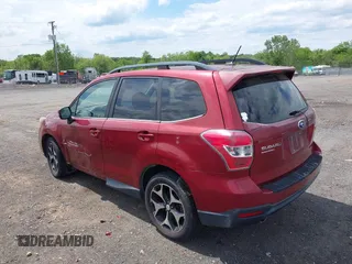 2014 Subaru Forester XT Touring with VIN JF2SJGMC1EH500150, listed as a IAAI auction lot 42201409 with 106,728 mi miles and . Bid and sale history available at DreamBid. Image 3.