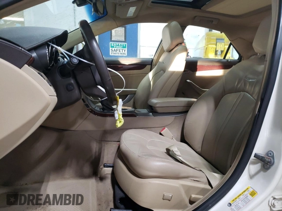 2013 Cadillac CTS Premium z VIN 1G6DS5E3XD0101681, wystawiony jako Copart lot #41334385 z przebiegiem 49 646 mil mil oraz Szkoda całkowita • Salvage title. Historia ofert i sprzedaży dostępna na DreamBid. Obrazek 7.