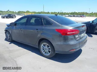 2016 Ford Focus SE with VIN 1FADP3F25GL338158, listed as a IAAI auction lot 39234785 with 77,333 mi miles. Bid and sale history available at carsss.com. Image 3.