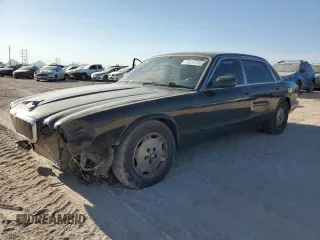 1997 Jaguar XJ with VIN SAJHX6245VC791604, listed as a Copart auction lot 70238764 with 138,147 mi miles and Salvage title. Bid and sale history available at DreamBid. Image 1.