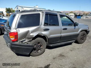 1999 Jeep Grand Cherokee Laredo with VIN 1J4GW58N4XC739465, listed as a Copart auction lot 76130544 with 195,649 mi miles and Salvage Title. Bid and sale history available at carsss.com. Image 3.