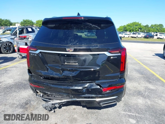 2020 Cadillac XT6 FWD Premium Luxury with VIN 1GYKPCRS7LZ211197, listed as a IAAI auction lot 42231424 with 57,351 mi miles and . Bid and sale history available at DreamBid. Image 16.