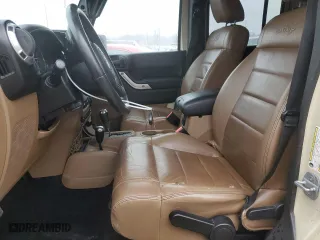 2011 Jeep Wrangler Unlimited Sahara with VIN 1J4BA5H19BL562457, listed as a Copart auction lot 44646965 with 184,155 mi miles and Salvage Title. Bid and sale history available at carsss.com. Image 7.