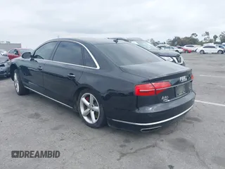 2015 Audi A8 L 4.0T with VIN WAU32AFD4FN033471, listed as a IAAI auction lot 42120112 with 174,882 mi miles. Bid and sale history available at carsss.com. Image 3.