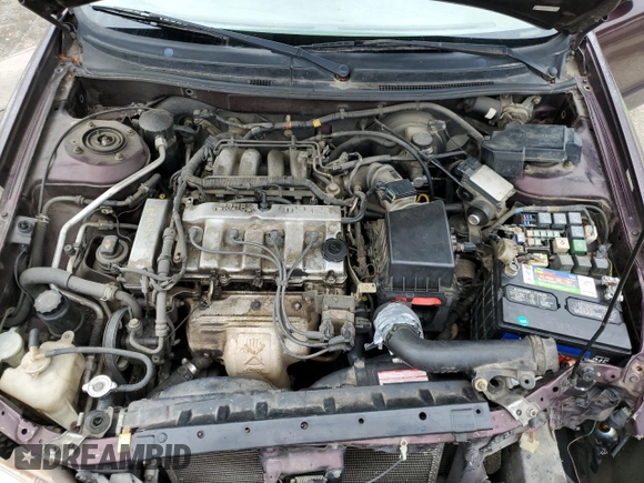 1998 Mazda 626 DX z VIN 1YVGF22CXW5775511, wystawiony jako Copart lot #78748784 z przebiegiem 158 570 mil mil oraz Szkoda całkowita • Salvage title. Historia ofert i sprzedaży dostępna na DreamBid. Obrazek 12.