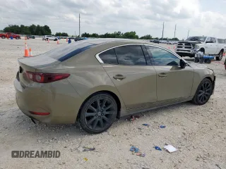 2024 Mazda 3 Carbon Edition with VIN 3MZBPBXYXRM409075, listed as a Copart auction lot 59189265 with 23,114 mi miles and Salvage title. Bid and sale history available at DreamBid. Image 3.