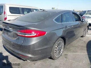 2017 Ford Fusion Energi Titanium with VIN 3FA6P0SU5HR105477, listed as a IAAI auction lot 41072696 with 92,926 mi miles. Bid and sale history available at carsss.com. Image 4.