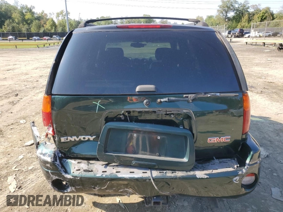 2003 GMC Envoy SLT with VIN 1GKDT13S032396374, listed as a Copart auction lot 74675134 with 115,280 mi miles and Salvage Title. Bid and sale history available at DreamBid. Image 6.
