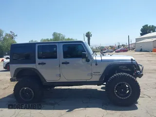 2018 Jeep Wrangler Unlimited Sport with VIN 1C4BJWDG4JL807265, listed as a IAAI auction lot 42520648 with 69,229 mi miles and . Bid and sale history available at DreamBid. Image 14.