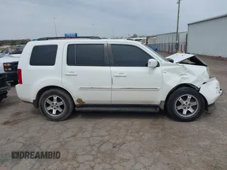 2009 Honda Pilot Touring with VIN 5FNYF48929B032510, listed as a IAAI auction lot 41945923 with 236,256 mi miles and . Bid and sale history available at carsss.com. Image 14.