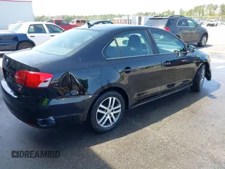 2011 Volkswagen Jetta Sedan SE w/Convenience & Sunroof with VIN 3VWDX7AJ5BM354817, listed as a IAAI auction lot 41919430 with 156,284 mi miles. Bid and sale history available at carsss.com. Image 4.