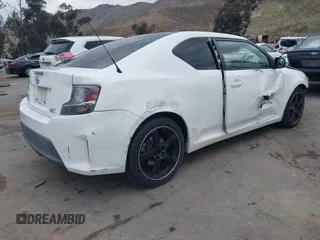 2014 Scion tC with VIN JTKJF5C79E3075707, listed as a IAAI auction lot 41557310 with 132,468 mi miles. Bid and sale history available at carsss.com. Image 4.