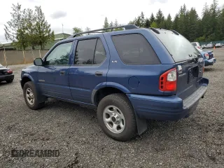 2002 Isuzu Rodeo S with VIN 4S2CK58W124301647, listed as a Copart auction lot 56973895 with 129,009 mi miles and Salvage title. Bid and sale history available at DreamBid. Image 2.