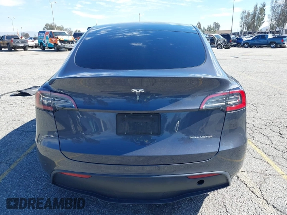 2022 Tesla Model Y Long Range with VIN 7SAYGAEEXNF381389, listed as a IAAI auction lot 41613075 with 52,800 mi miles and . Bid and sale history available at carsss.com. Image 16.