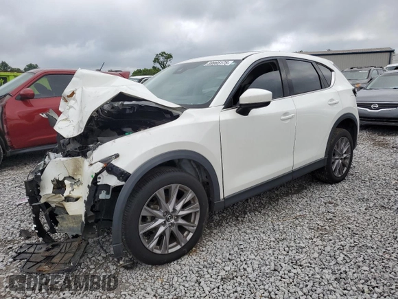 2019 Mazda CX-5 Grand Touring with VIN JM3KFADM6K1581261, listed as a Copart auction lot 59965175 with 127,837 mi miles and Salvage title. Bid and sale history available at DreamBid. Image 1.