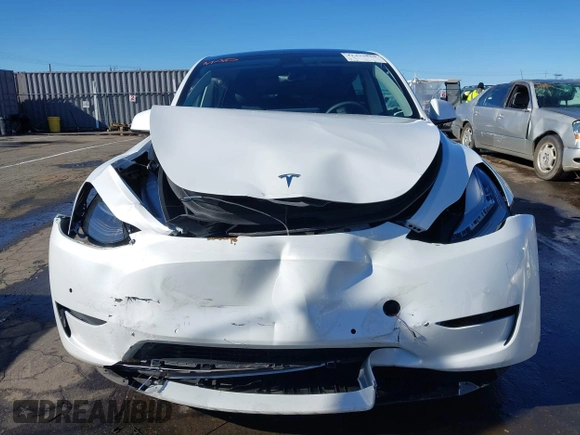 2022 Tesla Model Y Long Range with VIN 7SAYGDEE1NF402745, listed as a IAAI auction lot 41493850 with 11,222 mi miles and . Bid and sale history available at DreamBid. Image 12.