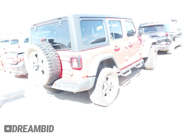 2019 Jeep Wrangler Unlimited Sahara with VIN 1C4HJXEG7KW551864, listed as a IAAI auction lot 42170875 with 115,695 mi miles and . Bid and sale history available at DreamBid. Image 4.