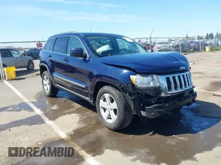 2012 Jeep Grand Cherokee Laredo with VIN 1C4RJFAG0CC160255, listed as a IAAI auction lot 41967809 with 127,702 mi miles. Bid and sale history available at carsss.com. Image 1.