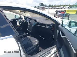 2013 Tesla Model S with VIN 5YJSA1CG4DFP21658, listed as a IAAI auction lot 42398609 with 116,068 mi miles and . Bid and sale history available at DreamBid. Image 5.