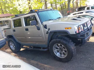 2005 Hummer H2 SUT with VIN 5GRGN22UX5H106653, listed as a IAAI auction lot 42015559 with 180,519 mi miles. Bid and sale history available at carsss.com. Image 13.