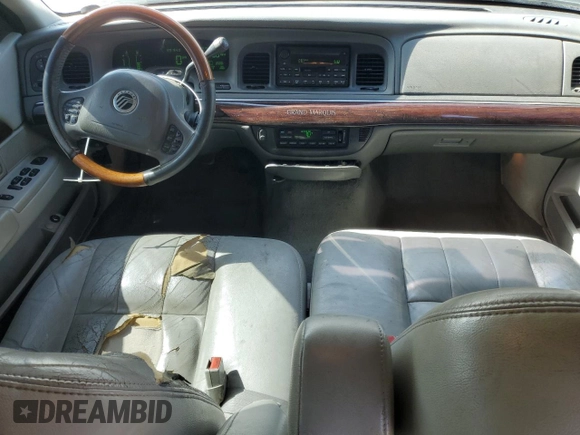 2003 Mercury Grand Marquis LS Premium with VIN 2MEHM75W63X697725, listed as a Copart auction lot 54485505 with 129,194 mi miles and Salvage Title. Bid and sale history available at DreamBid. Image 8.