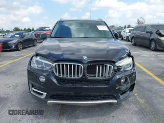 2016 BMW X5 xDrive50i with VIN 5UXKR6C51G0J81658, listed as a IAAI auction lot 41801382 with 34,572 mi miles. Bid and sale history available at carsss.com. Image 6.