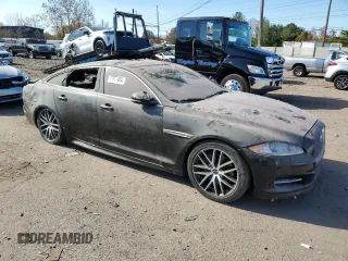 2015 Jaguar XJ with VIN SAJWJ1CD1F8V90815, listed as a Copart auction lot 77977464 with Not provided miles and Salvage title. Bid and sale history available at DreamBid. Image 4.