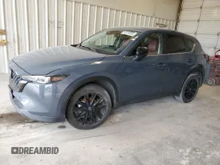 2023 Mazda CX-5 S Carbon Edition z VIN JM3KFBCM2P0267823, wystawiony jako Copart lot #53239255 z przebiegiem 22 096 mil mil oraz Szkody całkowita. Historia ofert i sprzedaży dostępna na DreamBid. Obrazek 1.