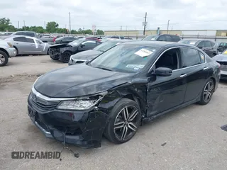 2016 Honda Accord Touring with VIN 1HGCR3F94GA004410, listed as a IAAI auction lot 42288402 with 139,068 mi miles and . Bid and sale history available at DreamBid. Image 17.